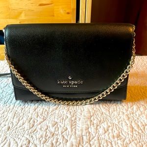 Kate Spade Carson Convertible Crossbody in black saffiano leather. Gold hardware
